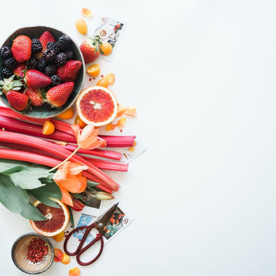 Fresh plant-based meal ingredients including vegetables, grains, and legumes arranged on a table