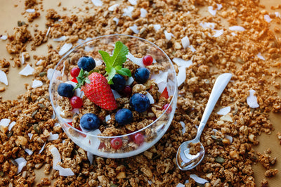 Ground flaxseed in a bowl of granola, a plant-based source of ALA omega-3 fatty acids