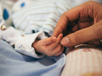 Pregnant woman considering omega-3 DHA supplement options for prenatal nutrition